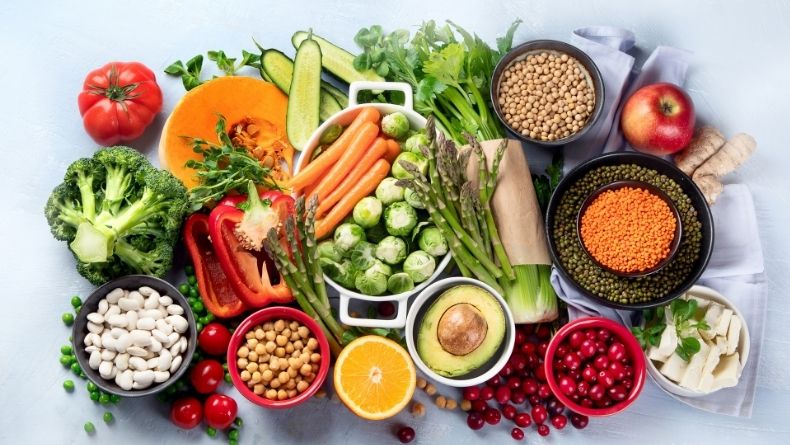 legumes, nuts and seeds, fruits, vegetables, and whole grains: group of foods that are high in iron and suitable for vegans