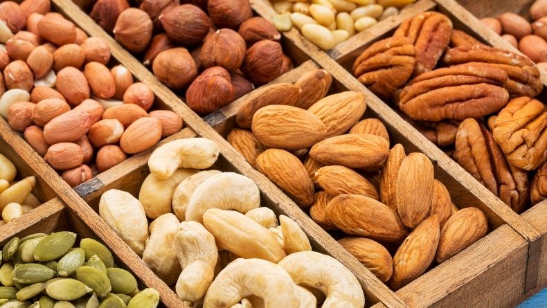 Different types of nuts (cashed, pine nuts, pistachios) that are high in non-heme iron
